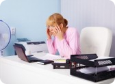 9536499-very-busy-blonde-in-the-office-workplace.jpg